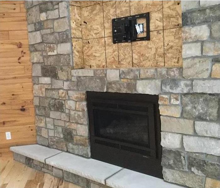 Fireplace with new stone and framework.