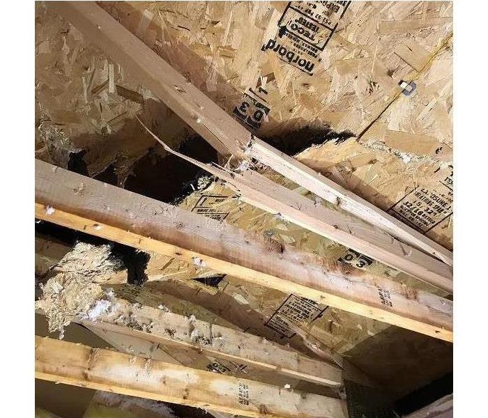 Exposed trusses due to storm damage. 
